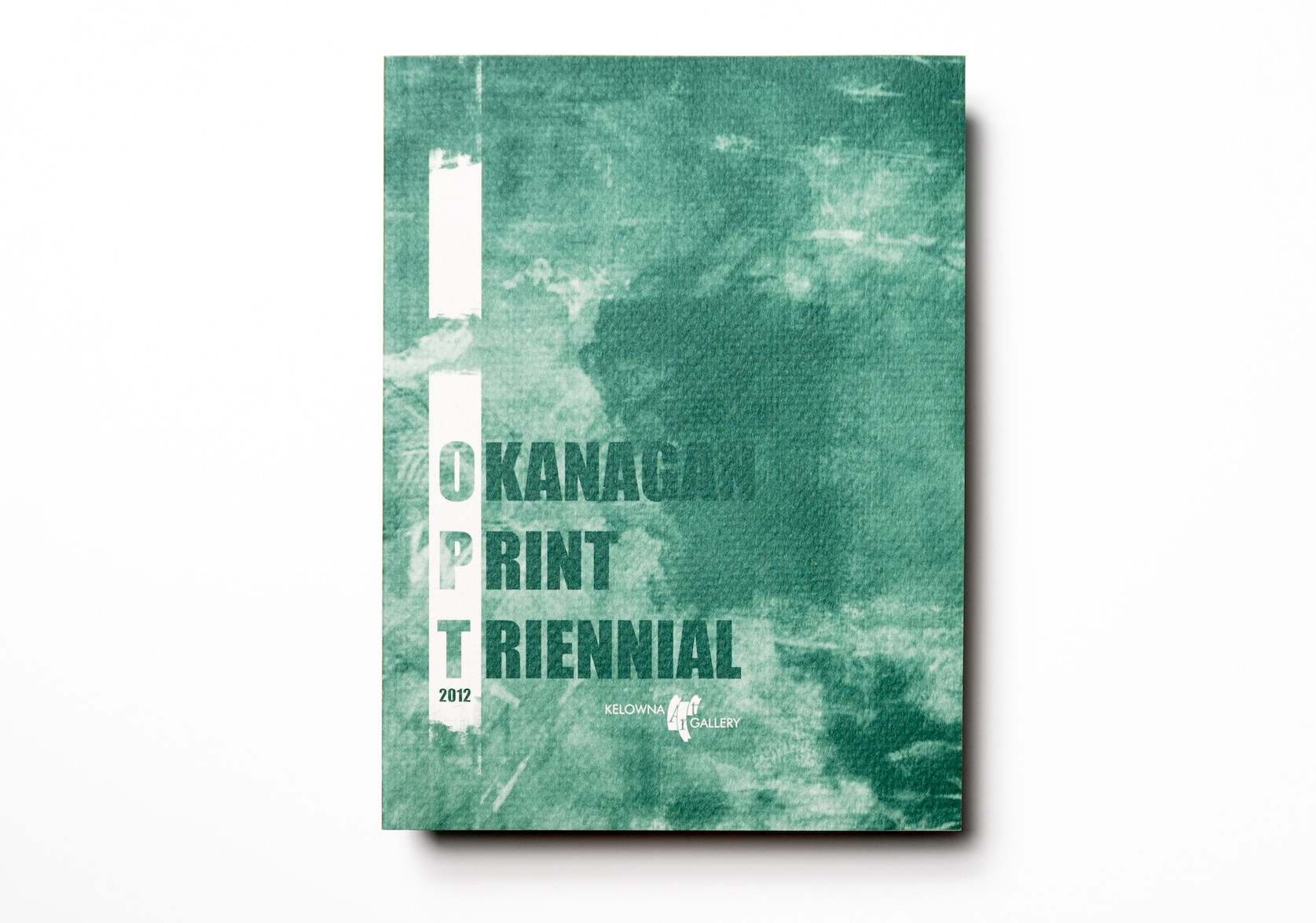 Catalogue Cover with text that reads: Okanagan Print Triennial 2012 with white & green watercolour background