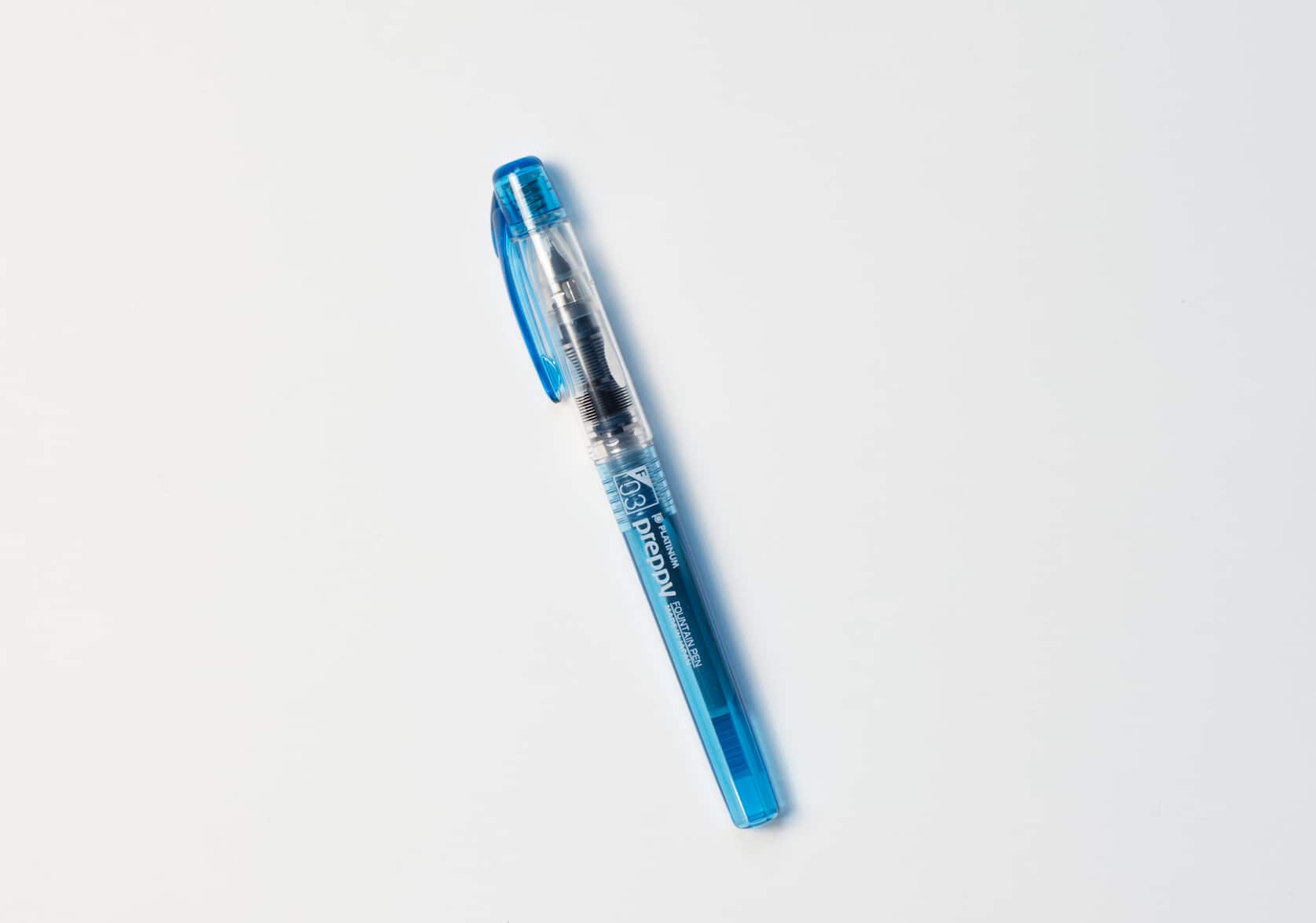 Fountain pen with a blue black barrel and pen clip. White text reads: Preppy
