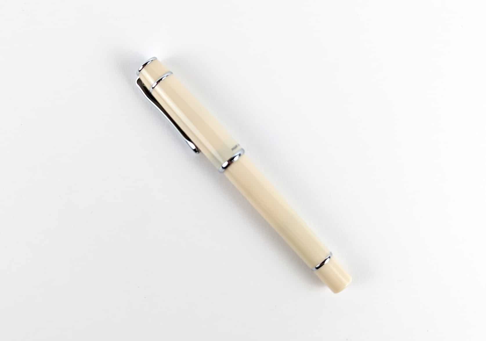 Ivory fountain pen with silver pen clip.