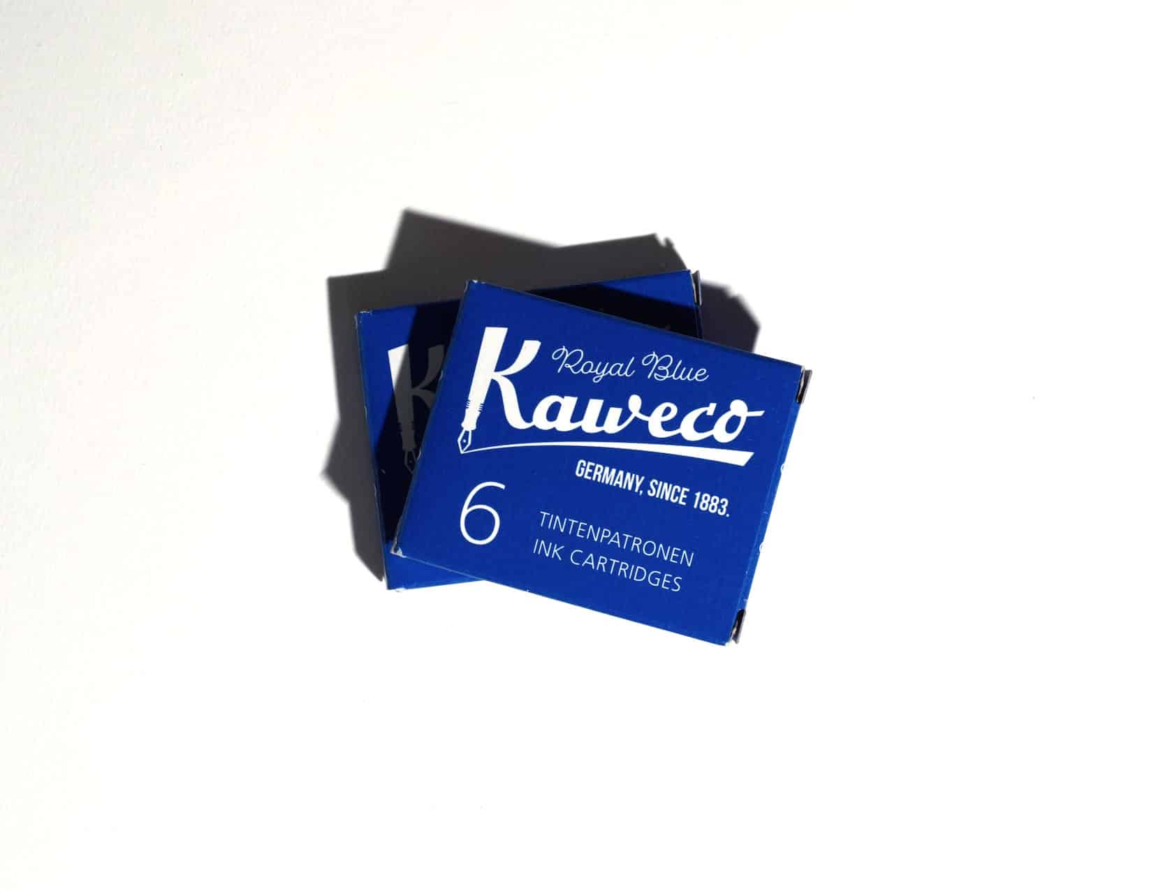 Two boxes of ink cartridges lie on a white surface. Text on packaging reads: Kaweco. Royal Blue. Germany, since 1883. 6 Tintenpatronen. Ink Cartridges.
