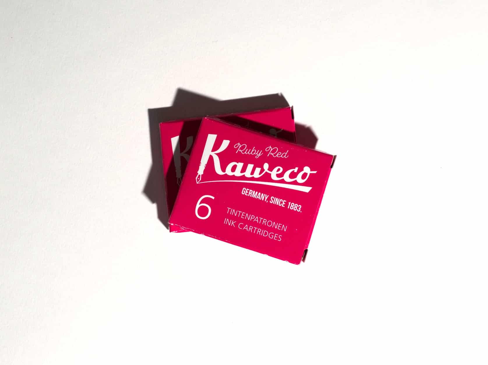 Two boxes of ink cartridges lie on a white surface. Text on packaging reads: Kaweco. Ruby Red. Germany, since 1883. 6 Tintenpatronen. Ink Cartridges.
