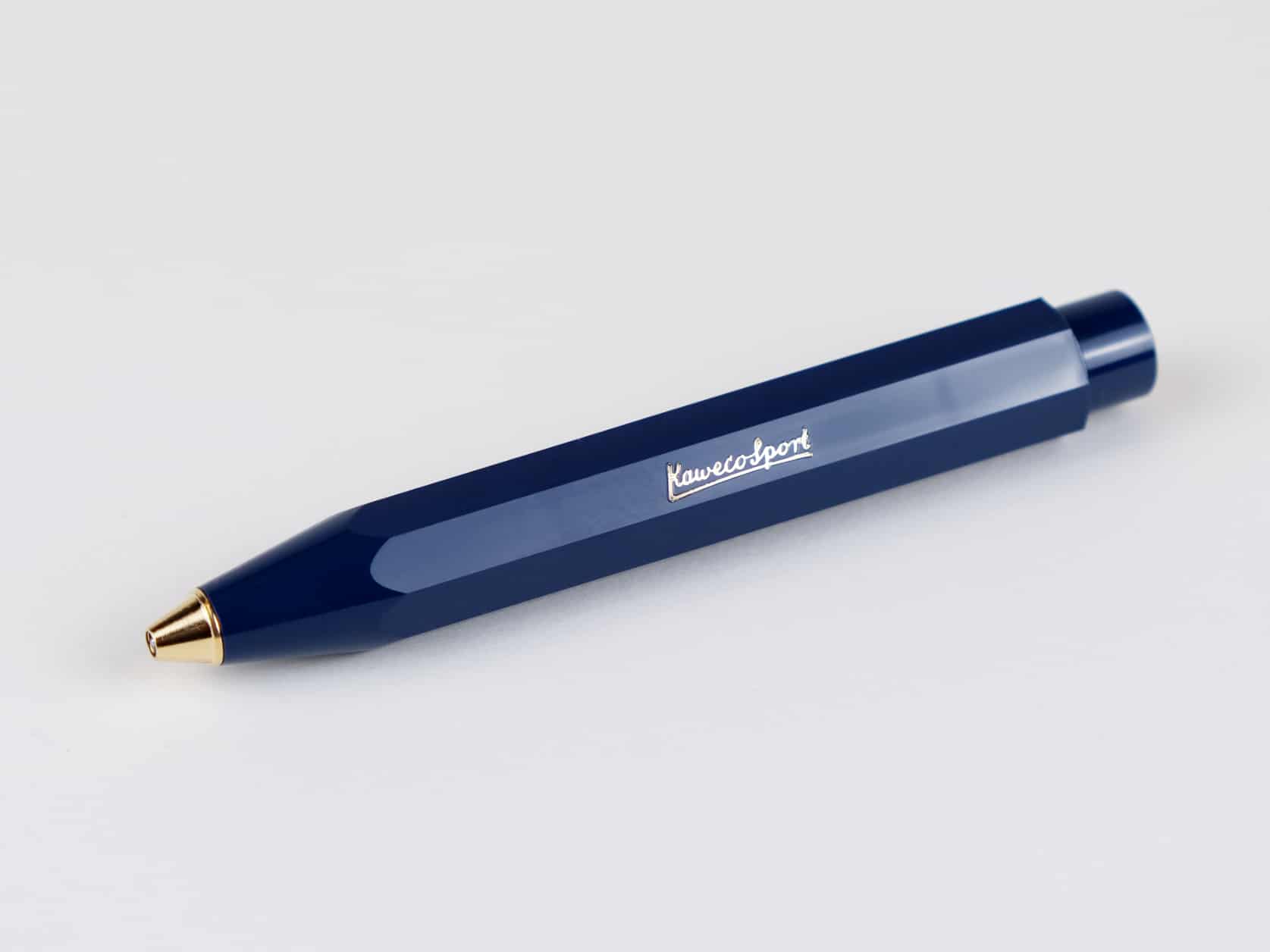 A blue acrylic ballpoint pen with a golden tip